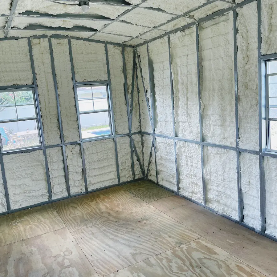 Closed-cell spray foam insulation applied to wall cavities in a residential project in Forsyth